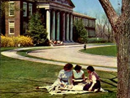 Young women studying on east lawn of Rockwell Hall ca. 1960's